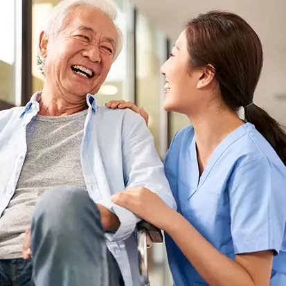 An elderly man smiling from the exceptional care at the SeniorSelect Center.